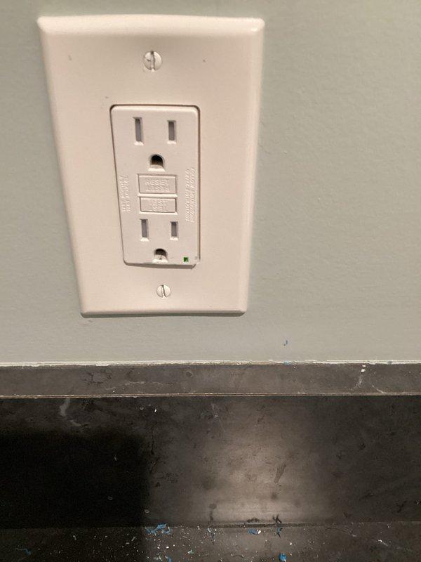 Diagnosed and repaired loose connections causing intermittent operation of the under-cabinet kitchen lighting, and troubleshot and corrected the fault causing flickering at the basement entry door lights. Installed a new receptacle in the laundry room below the existing outlet, then verified correct wiring and 121 VAC output with an outlet tester, confirming proper operation of the circuit.