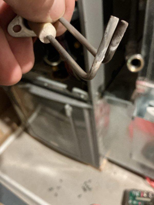 Performed annual heating tune-up on a 7-year-old Rheem gas furnace with whole-home humidifier. Removed and inspected the burner assembly and flame sensor, which showed oxidation, soot, and mineral buildup, and cleaned the components to restore proper flame sensing and ignition reliability. Verified safe, normal furnace operation after reassembly.