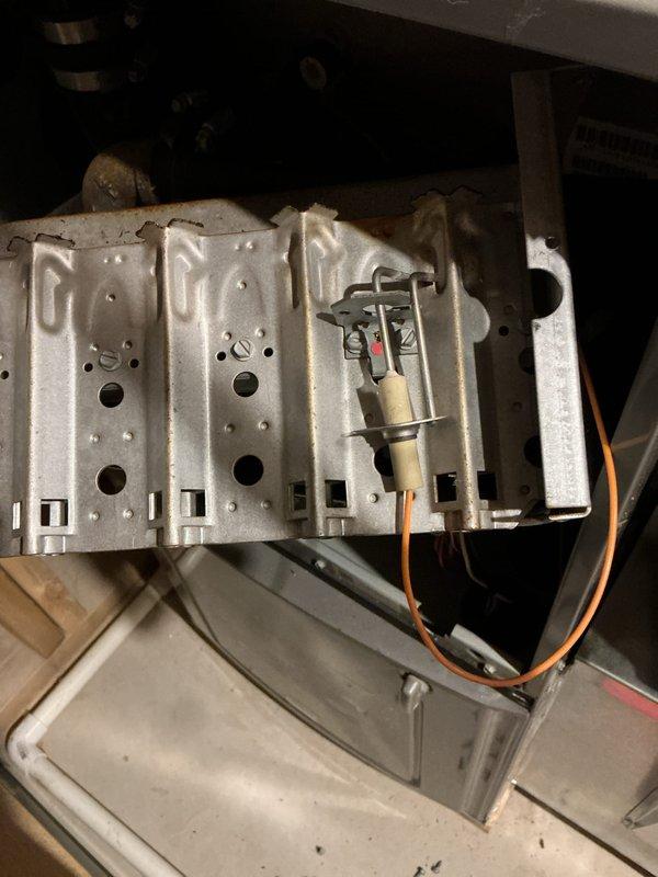 Performed annual heating tune-up on a 7-year-old Rheem gas furnace with whole-home humidifier. Removed and inspected the burner assembly and flame sensor, which showed oxidation, soot, and mineral buildup, and cleaned the components to restore proper flame sensing and ignition reliability. Verified safe, normal furnace operation after reassembly.