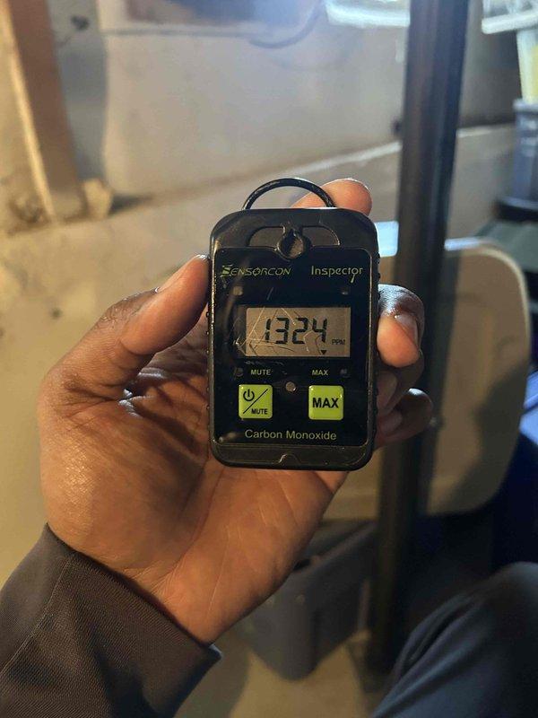 Performed a furnace super tune-up, including inspection of the cabinet, control board, wiring, condensate drain assembly, and air filter. A carbon monoxide reading of 1324 PPM was recorded at the unit, indicating a serious combustion or venting problem, and significant corrosion and moisture were found in the lower cabinet pan near the coil. Because of the elevated CO level and corrosion, the furnace should not be operated until a combustion analysis, heat exchanger and flue inspection, and repair of the water intrusion source are completed.