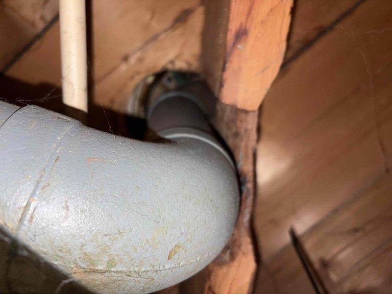 Responded to a reported sewer line backup with leakage at the basement drain pipe. Inspected the cast iron main drain stack and overhead piping at the joist level, including fittings and joints, and documented findings with photos. Identified the condition affecting drain flow and the source of the leakage at the pipe, and advised on the necessary repairs to restore proper drainage.