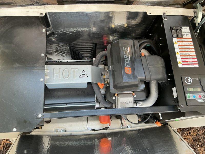 Performed a complete tune-up on a Generac standby generator with an Evolution 2.0 controller, including inspection of the engine compartment, oil system (fill cap, dipstick, and filter), hoses, wiring, and heat shield. Components were found clean and in good condition, with no frost or damage, and only minor surface rust speckling on a flexible hose and light paint cracking on the alternator housing, neither affecting operation. The unit was left ready for standby operation.