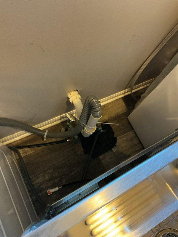 Installed a new laundry tub sink in the laundry room and connected it to the existing drain and supply plumbing. Verified the drain tie-in to the existing PVC waste line, secured the flexible drain connections, and confirmed proper flow with no leaks at the fittings.