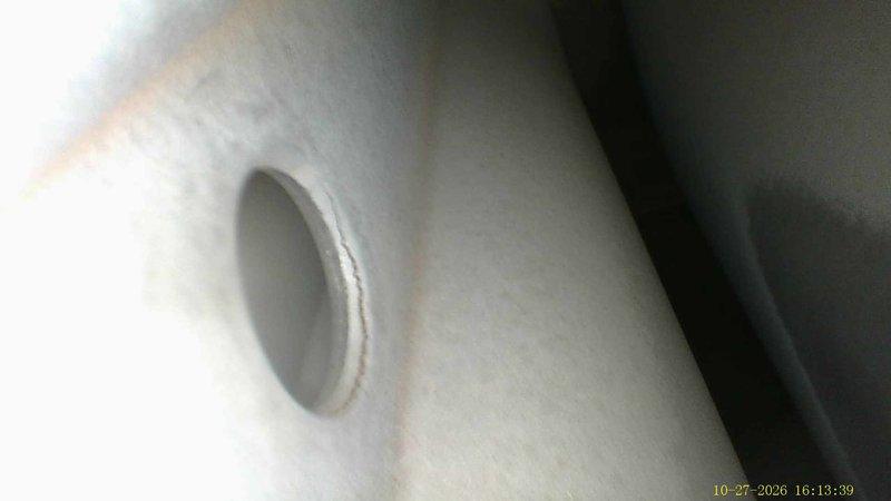 Performed a complete furnace super tune-up on a 28-year-old unit, including a borescope inspection of the heat exchanger. Imaging revealed a crack along the seam at an exchanger port opening, as well as heavy rust, flaking scale, and pitting corrosion around a second opening, indicating advanced deterioration and a potential safety hazard. The unit's age and the condition of the heat exchanger were documented for the customer's review of repair and replacement options.