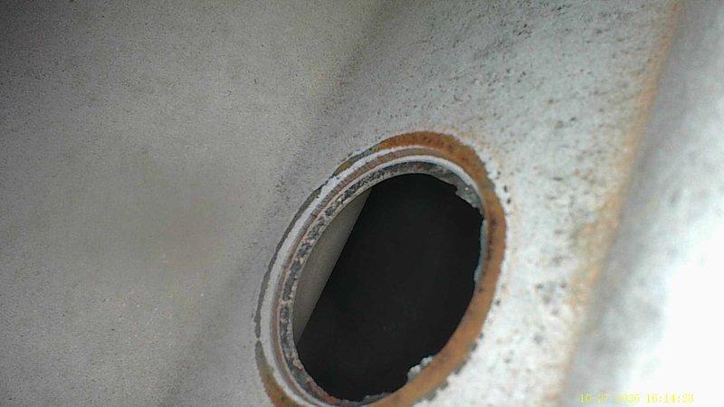 Performed a complete furnace super tune-up on a 28-year-old unit, including a borescope inspection of the heat exchanger. Imaging revealed a crack along the seam at an exchanger port opening, as well as heavy rust, flaking scale, and pitting corrosion around a second opening, indicating advanced deterioration and a potential safety hazard. The unit's age and the condition of the heat exchanger were documented for the customer's review of repair and replacement options.