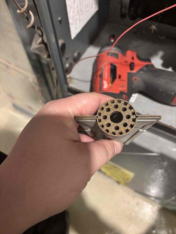 Performed annual heating tune-ups on two gas furnaces, including the attic unit. Removed and inspected the burner assemblies, finding carbon buildup, discoloration, and light scaling on the burner ports. Cleaned the burners, checked the heat exchanger areas, and reassembled the components. Verified proper ignition and flame characteristics, and confirmed safe, normal operation of both systems at completion.