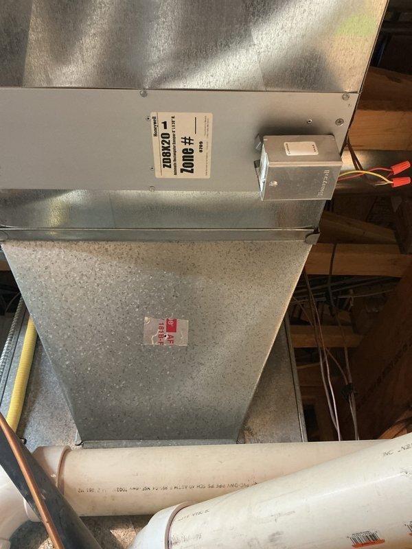 Performed a furnace super tune-up on a 20-year-old unit, including inspection and operational check of the heating system and associated zone control components. Verified Honeywell zone dampers and actuators (ZD8X20 and ZD10X20) with their low-voltage wiring connections, and confirmed gas supply piping, hydronic PEX/valve connections, and condensate/PVC drain lines showed no visible leaks, rust, or damage.