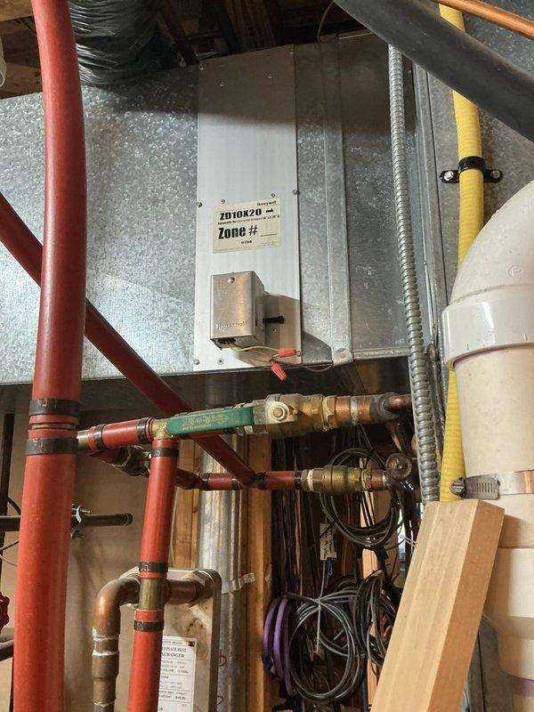 Performed a furnace super tune-up on a 20-year-old unit, including inspection and operational check of the heating system and associated zone control components. Verified Honeywell zone dampers and actuators (ZD8X20 and ZD10X20) with their low-voltage wiring connections, and confirmed gas supply piping, hydronic PEX/valve connections, and condensate/PVC drain lines showed no visible leaks, rust, or damage.