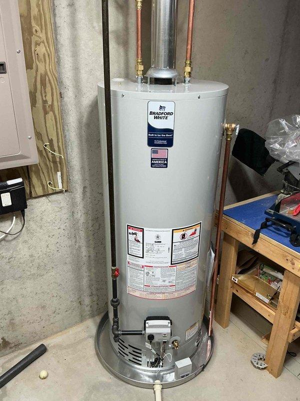 Installed a new gas furnace with matched A/C coil cabinet in the basement mechanical area, connecting it to the existing supply plenum, gas line, and PVC condensate/venting. Reconnected the existing whole-house humidifier to the supply ductwork, verified secure connections, and confirmed proper system operation upon completion.