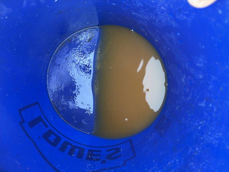 Responded to a Bradford White gas water heater (approx. 9 years old) reporting excessive outlet temperature and a recurring temperature limit fault. Inspected the unit and flue/venting, and flushed the tank, which produced discolored, sediment-laden discharge indicating heavy mineral and sediment buildup likely contributing to overheating and thermostat/ECO limit trips. Restored the unit to operation after the flush and verified the temperature control and burner function.