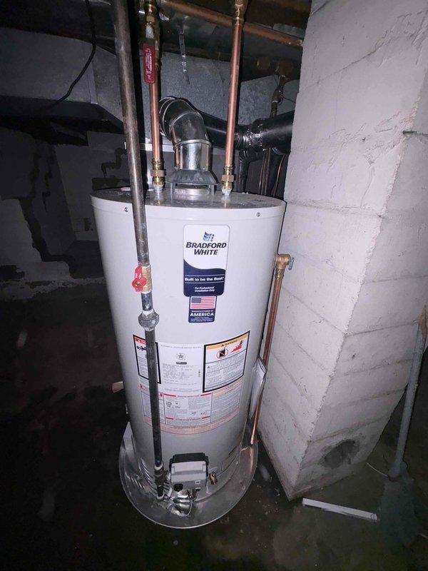Installed a new 40-gallon natural gas, non-direct-vent (atmospheric) water heater with a 6/6 gas-to-vent configuration in a short-profile model, replacing the existing unit. Installed a chimney liner to properly vent the appliance into the masonry chimney, and reconnected the water supply, gas line, and flue connections. Verified the gas shutoff valve, checked for leaks, and confirmed proper ignition, draft, and operation.