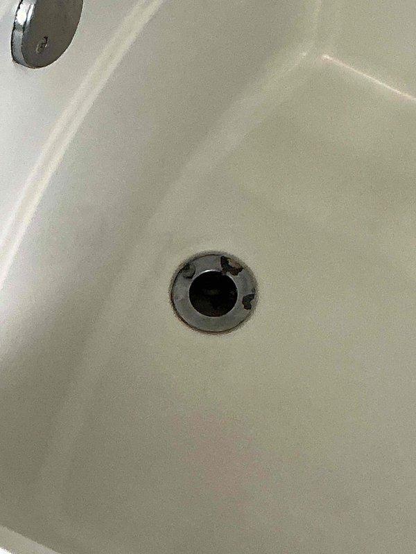 Replaced the bathroom faucet with the customer-supplied unit, including disconnecting the existing supply lines and verifying leak-free operation. Removed the corroded tub drain flange and stopper assembly and installed a new drain and stopper. Cleared the kitchen sink clog and confirmed proper drainage.