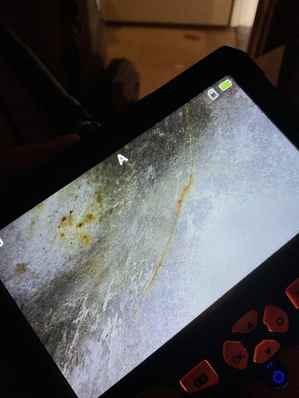Performed annual heating tune-up on a 24-year-old Carrier furnace and humidifier, including inspection of the system's components for proper operation. Used a borescope to examine the interior surfaces, which revealed surface rust and corrosion consistent with the unit's age, and documented the findings with photos for the service record.