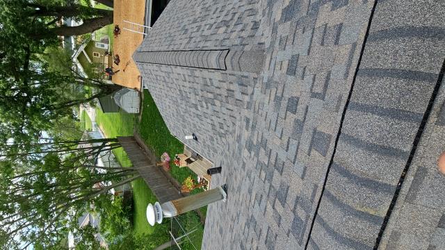 We installed a new roof, gutters, and a leaf blaster, transforming the home's appearance and functionality. The homeowner was thrilled with the stunning results.