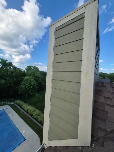 We inspected the chimneys and found damage. We redecked them, ensuring a solid foundation. The re-siding process was thorough, resulting in two beautifully restored chimneys.