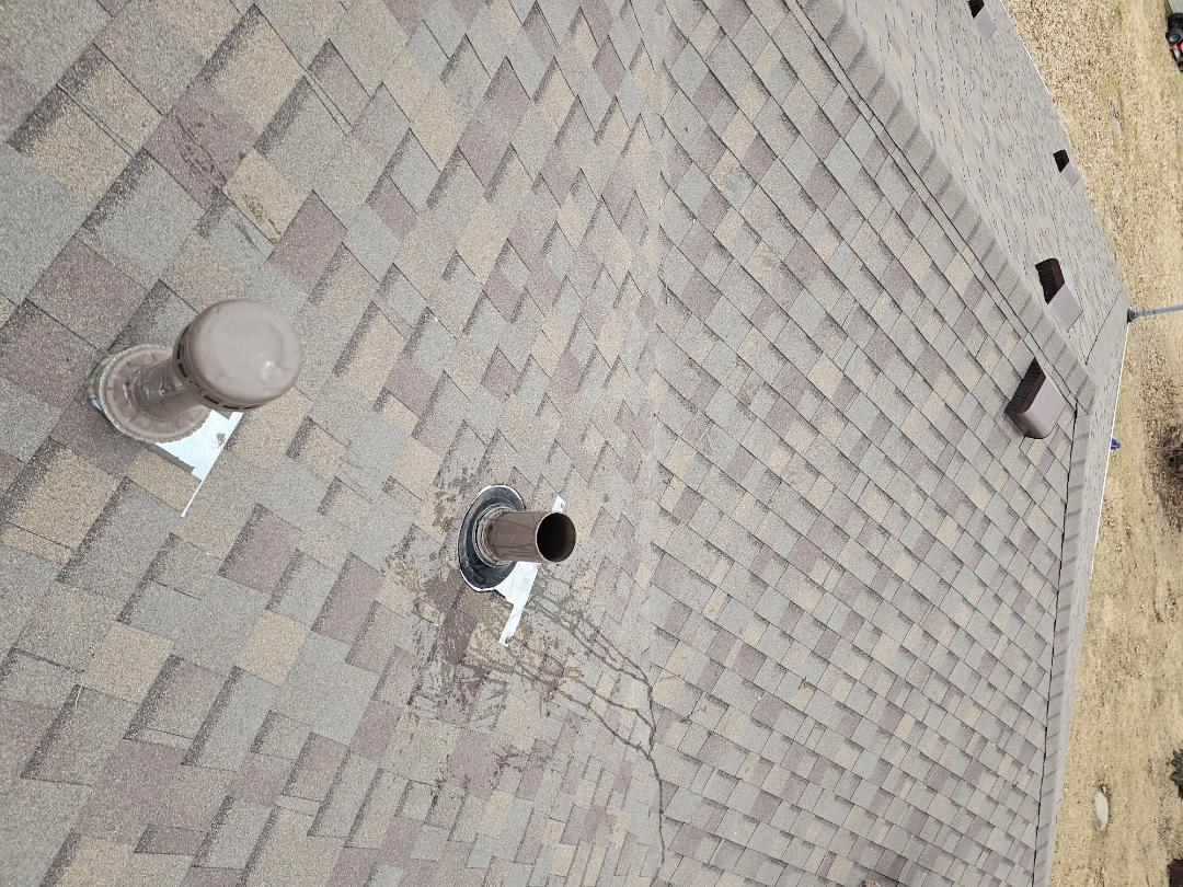 A homeowner contacted us due to water dripping in their basement, originating from a pipe. A plumber had previously inspected the situation and suggested that the flashing around the pipe, which penetrates the roof, might be leaking. Upon thorough examination, we confirmed that the flashing was correctly installed and not the source of the leak. We conducted a test by pouring water down the pipe, and as soon as the water passed through, we identified a leak in the basement. We informed the homeowner that the issue was likely a faulty pipe joint within the house and advised them to contact a local plumber for further inspection and repair. This ensured the leak would be properly addressed.