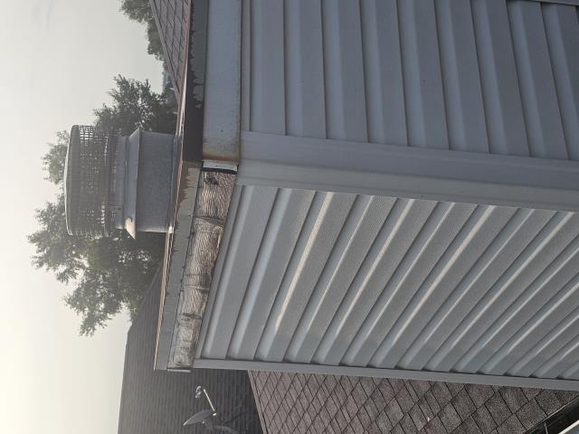 We installed a new chimney cap, repaired the board, wrapped the garage door, and completed fascia work. The homeowner was thrilled with the improved appearance and functionality.