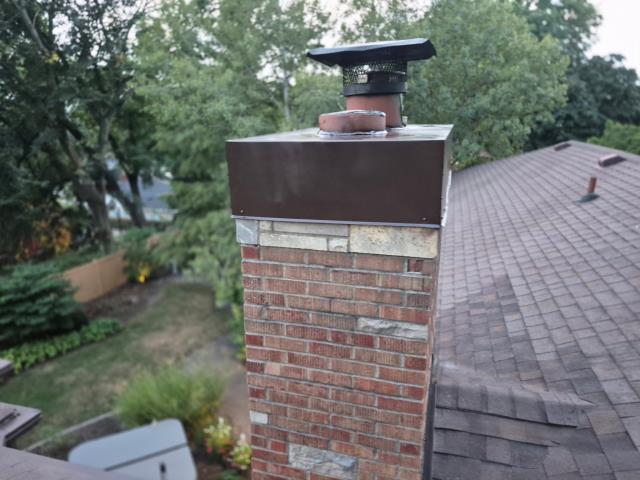 We fixed a leaking chimney by installing a durable cap and securing flashing around its base, ensuring it's now watertight and well-protected.