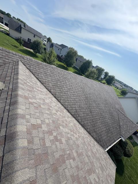 We installed a durable new roof and added a functional downspout, ensuring efficient water drainage and enhancing the home's overall appearance.