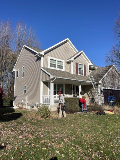 We expertly sided one side of the house, applied a sleek window wrap, and skillfully removed two decorative vents from both the garage and house.