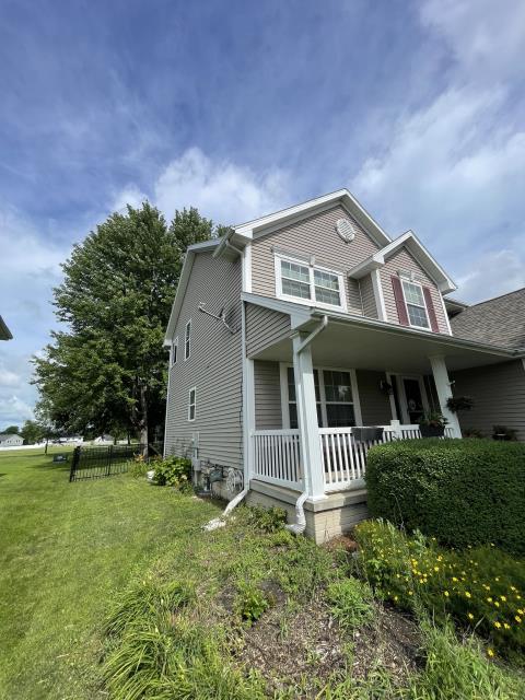 We expertly sided one side of the house, applied a sleek window wrap, and skillfully removed two decorative vents from both the garage and house.