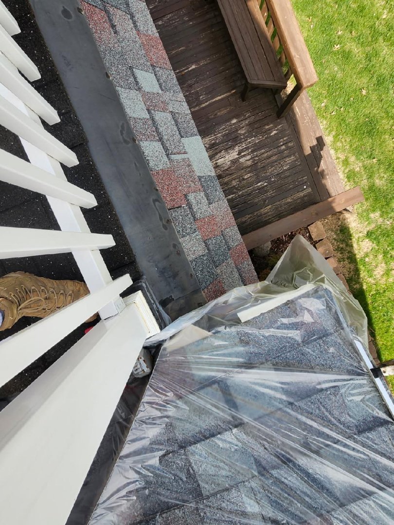 Upon receiving a call from the homeowner, we identified a persistent leak at the flatport areas where the asphalt roof meets. The issue was traced to a failing piece of flashing. To address this, we removed the compromised flashing and carefully extracted 45 rows of shingles. We then installed an ice and water barrier to enhance protection against future leaks. Following this, we reshingled the area using a modified bitumen technique to ensure durability. Finally, we reflashed the area properly, ensuring a watertight seal. The homeowner can n