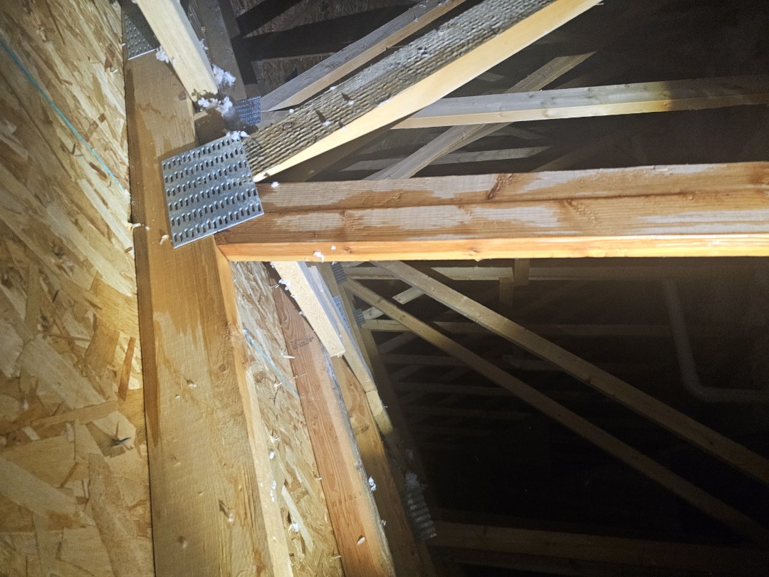 We received an urgent call from a family worried about water damage inside their home. They reported water dripping through a door frame and pooling on the floor. Concerned about a potential roof leak, we responded promptly. On Sunday, we conducted an initial inspection inside the house and attic, pinpointing the exact location of the leak. We then climbed onto the roof, measured the area, and identified a damaged shingle two rows above the leak. To prevent further water intrusion, we applied temporary tarping. We scheduled a full evaluation for the following Monday to inspe
