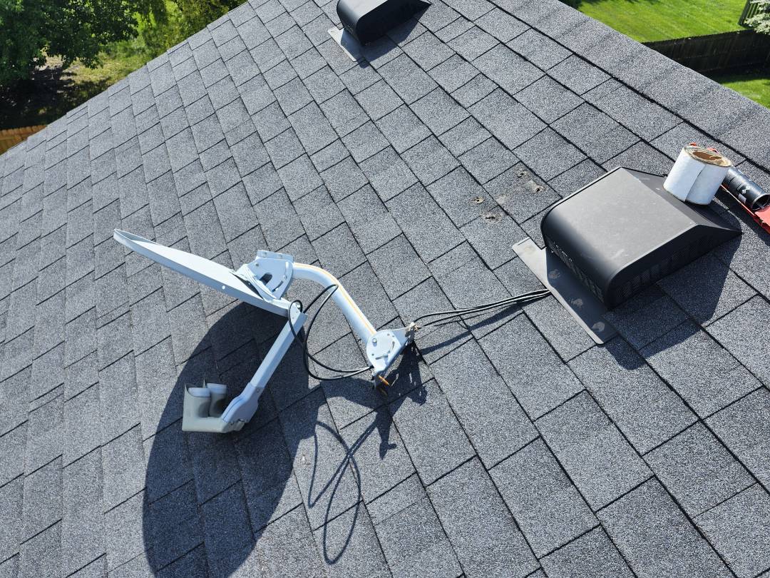A homeowner urgently contacted us after heavy rains caused water to spray into her bedroom. Upon arrival, we conducted a thorough inspection of the master bedroom fan and attic. We discovered four holes in the attic, likely from a dislodged solar dish for TV, which had blown off the roof. The insulation was soaked, so we removed a 3x4 foot section to allow it to dry. We recommended a mitigation company and fixed the roof to prevent further issues. We also offered a roof quote for future replacement. Despite the holiday weekend, we provided prompt and effective service.