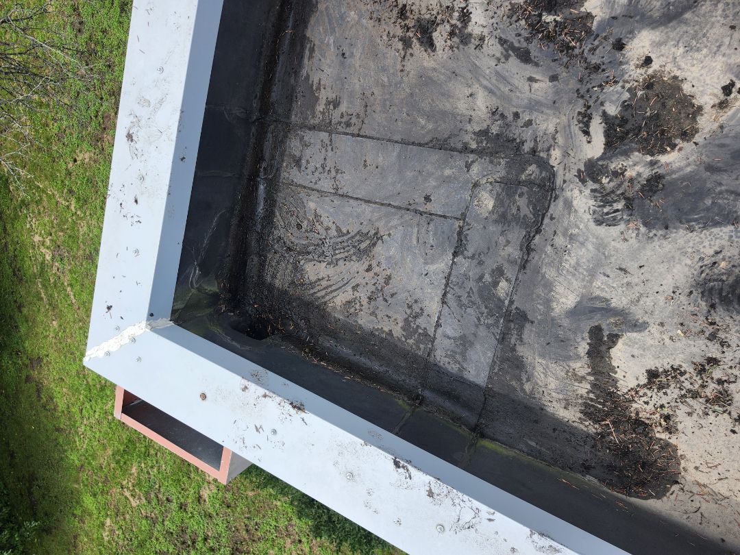 After a severe storm, a homeowner reached out for assistance. The heavy rains overwhelmed the drainage system, causing significant issues. Upon inspection, it was clear that the flat roof drainage was blocked, leading to water accumulation and potential leaks. Unlike previous contractors, we identified this critical issue and informed the homeowner. We cleaned the blocked drainage areas and performed temporary repairs to mitigate immediate risks. We recommended monitoring the situation and suggested that a full roof replacement was not necessary at