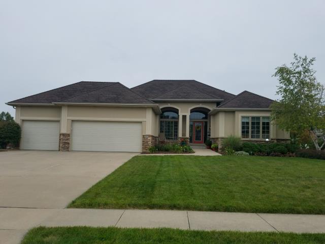 We replaced the entire roof and repaired the siding at this Johnston home, ensuring a fresh, durable finish.
