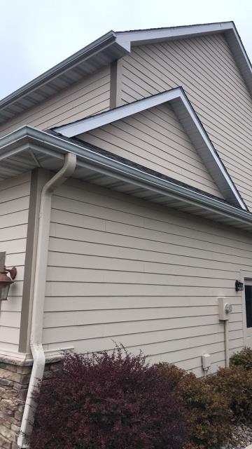 Completed a comprehensive roofing overhaul on this Johnston, IA home, installing new shingles and gutters to ensure long-lasting durability and optimal water drainage.