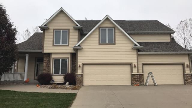 Completed a comprehensive roofing overhaul on this Johnston, IA home, installing new shingles and gutters to ensure long-lasting durability and optimal water drainage.