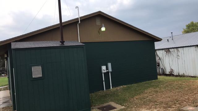 We completed a comprehensive roofing replacement on this commercial building in Grimes, Iowa, removing the old roofing and installing high-quality new materials.