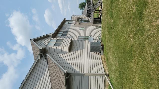We replaced the entire roof, installed new gutters, and repaired a significant section of the siding on this Grimes, IA home, ensuring lasting protection, improved water drainage, and enhanced curb appeal.