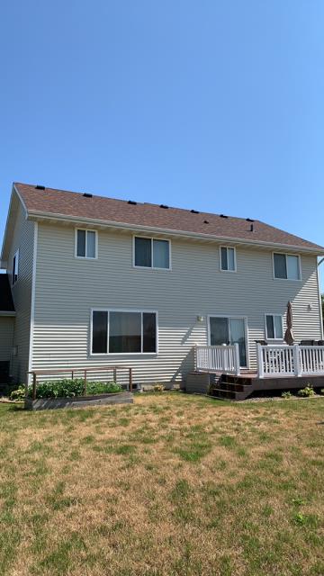 We completed extensive repairs to the roof and siding of this Grimes, Iowa property, addressing damaged areas and restoring the property’s protection, durability, and overall appearance.