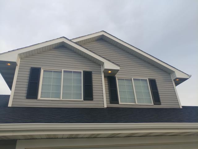 We replaced all gutters, installed new downspouts, and repaired the roof on this home in Bondurant, IA, ensuring optimal water flow and reliable protection against leaks.