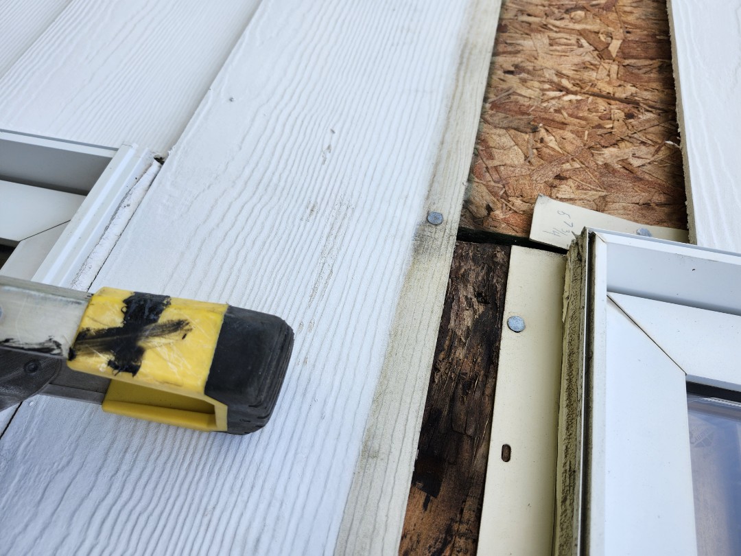 Provided the next year inspection prosiding to a homeowner. In walki, water was identified on the OSB. In the lower basement, we removed 2 pieces of siding on the exterior under both windows on the 1st floor and the 2nd floor water damage was identified to the plywood. The no house wrap was on the home. It is our recommendation that replacing of the siding o s b install a new house wrap, new window tape, new o s b is what is recommended