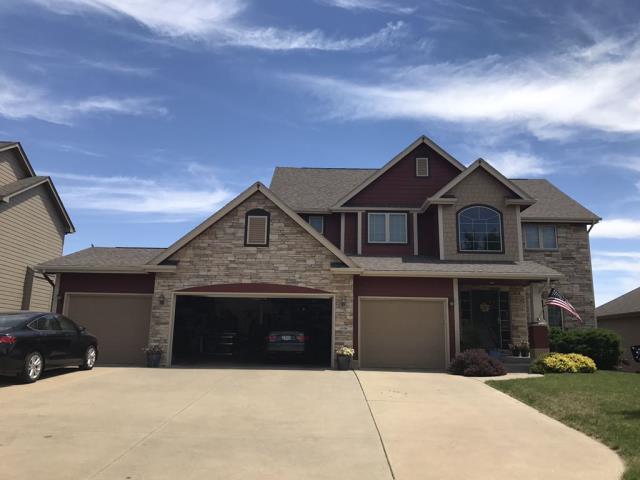 We completed a comprehensive roofing overhaul in Urbandale, IA, installing new shingles and gutters with precision to ensure lasting durability and curb appeal.