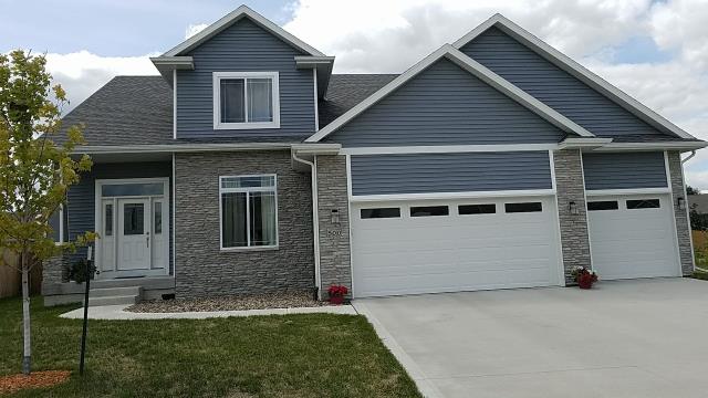 Replaced damaged siding panels and repaired loose boards in Bondurant, IA, applying weather-resistant sealant to ensure durability and enhance curb appeal.