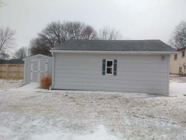 We completed a comprehensive roofing project on this Polk City, IA property, replacing the roofs on the main house, garage, and shed with high-quality materials to provide lasting durability and protection.