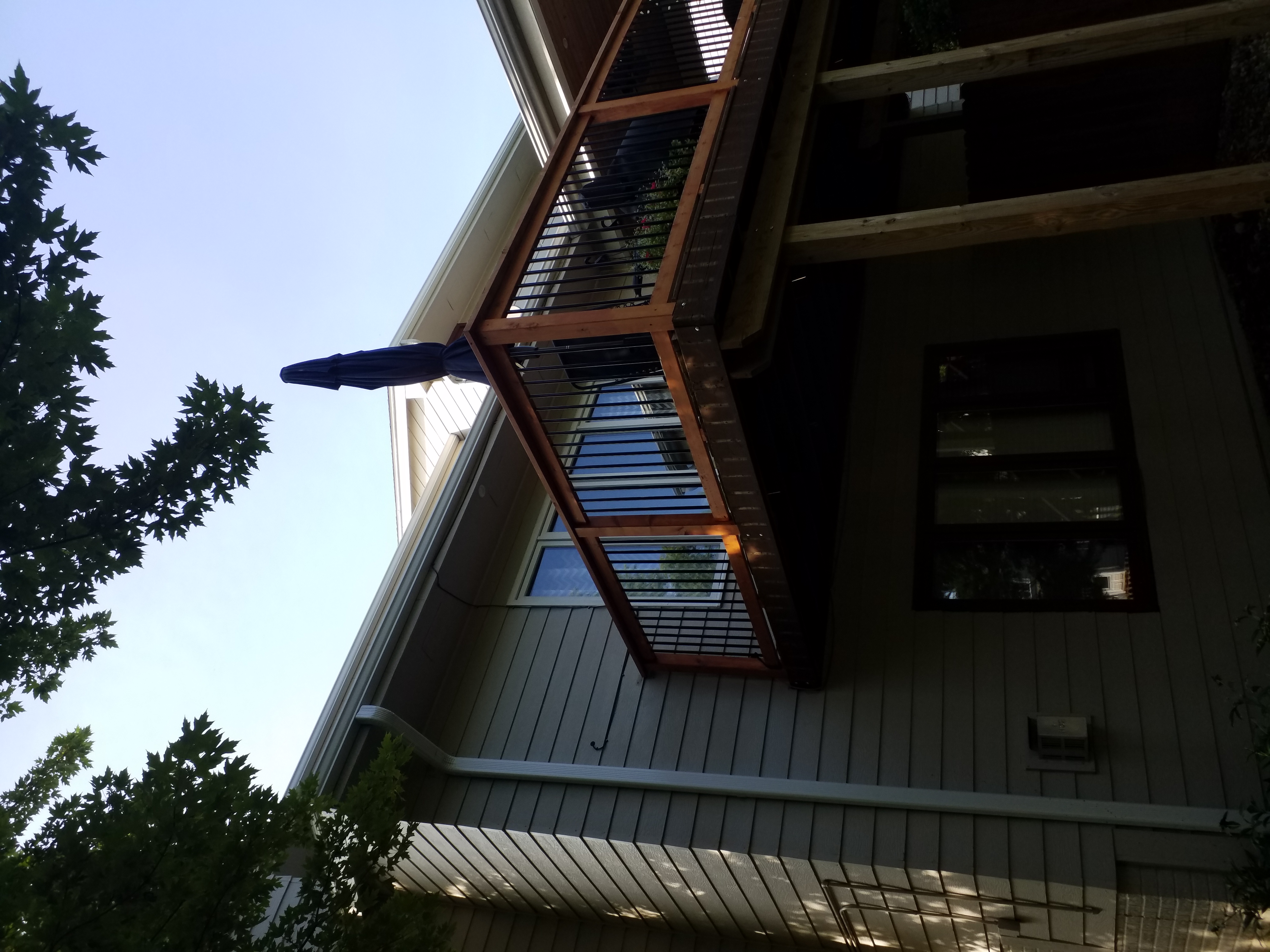 We installed new gutters and downspouts on the porch of this Clive, IA home to improve drainage and properly direct water away from the structure.