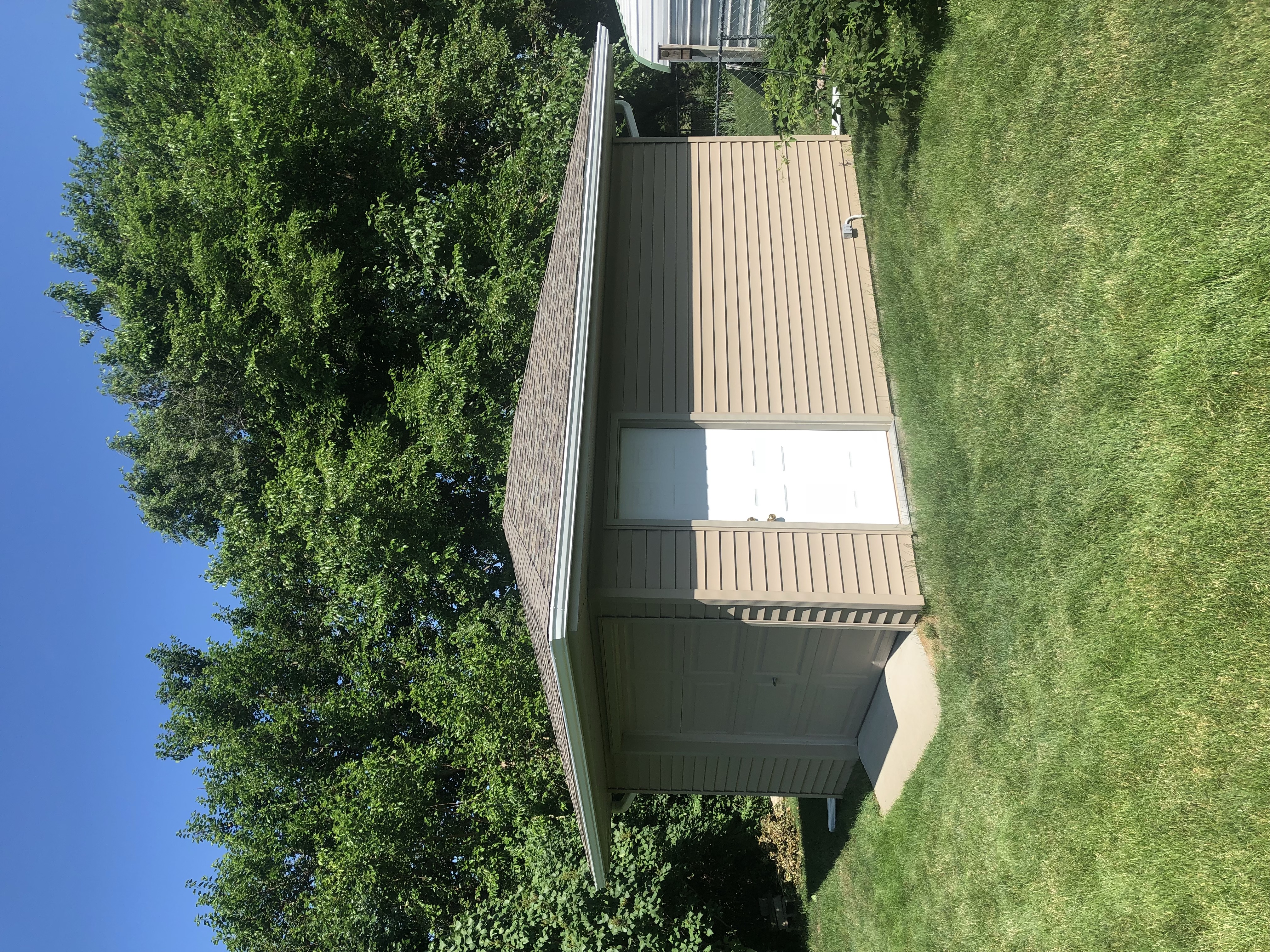 We completed a full roof replacement on this Des Moines, IA property, installing new roofing on the home, garage, and shed to provide lasting protection and a clean, finished look.
