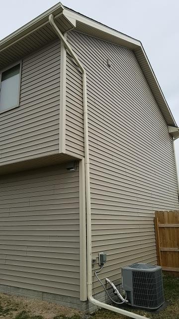 We completed exterior repairs on this Bondurant, IA home, including siding and fascia repairs along with the replacement of damaged downspouts for improved protection and drainage.
