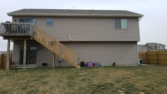 We completed exterior repairs on this Bondurant, IA home, including siding and fascia repairs along with the replacement of damaged downspouts for improved protection and drainage.