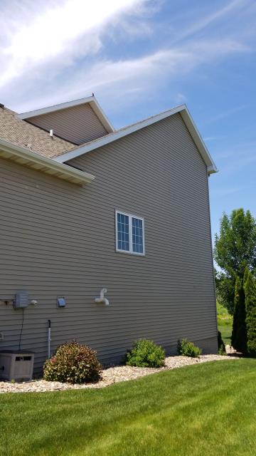 A new roof and gutter system were installed on this Johnston, IA home, improving weather protection and providing reliable water drainage for years to come.