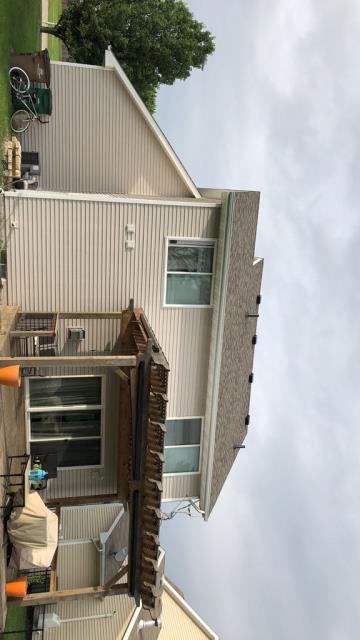 This West Des Moines, IA home received a new roof with proper ventilation, along with new gutters for improved drainage and dependable protection from the elements.