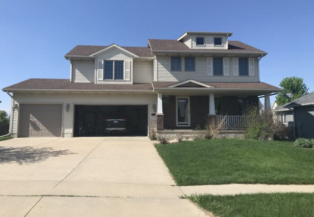 We completed a full roof replacement on this Urbandale, IA home, installing new, high-quality shingles to enhance durability and curb appeal.