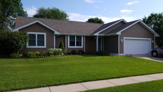 Our team installed a new roof and gutters on this Ames, IA home, providing lasting protection and improved water drainage.