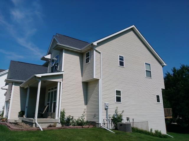 This Urbandale, IA home received a complete roof replacement along with new gutters, providing reliable protection and improved drainage while enhancing the home's overall appearance.