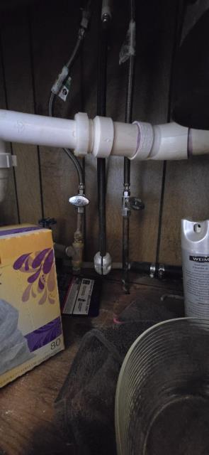 Replace leaking garbage disposal.